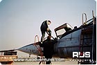 Flight MiG-25: co-pilot sits down in a cockpit